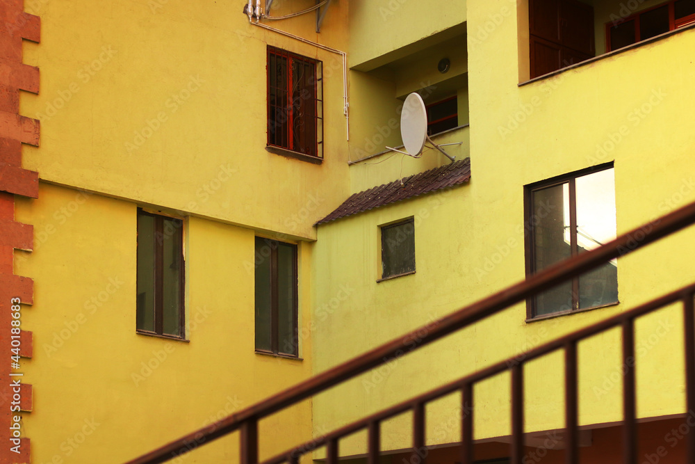 Details of the facade of a yellow building Details of the facade of a yellow building