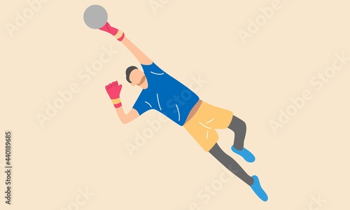 Jumping football goalkeeper catches the ball