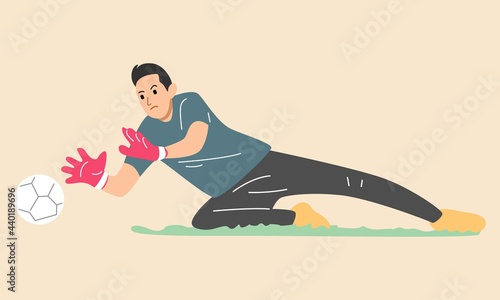 Jumping football goalkeeper catches the ball