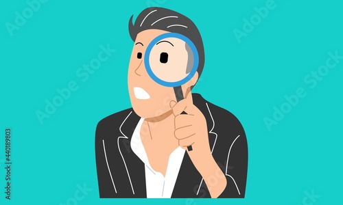 Young man holding magnifying glass