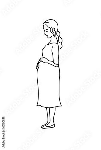 お腹を撫でる妊婦