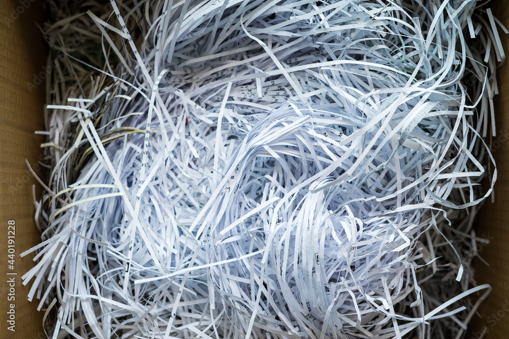 White shredded paper in a carboard box. White shredded paper in a carboard box.