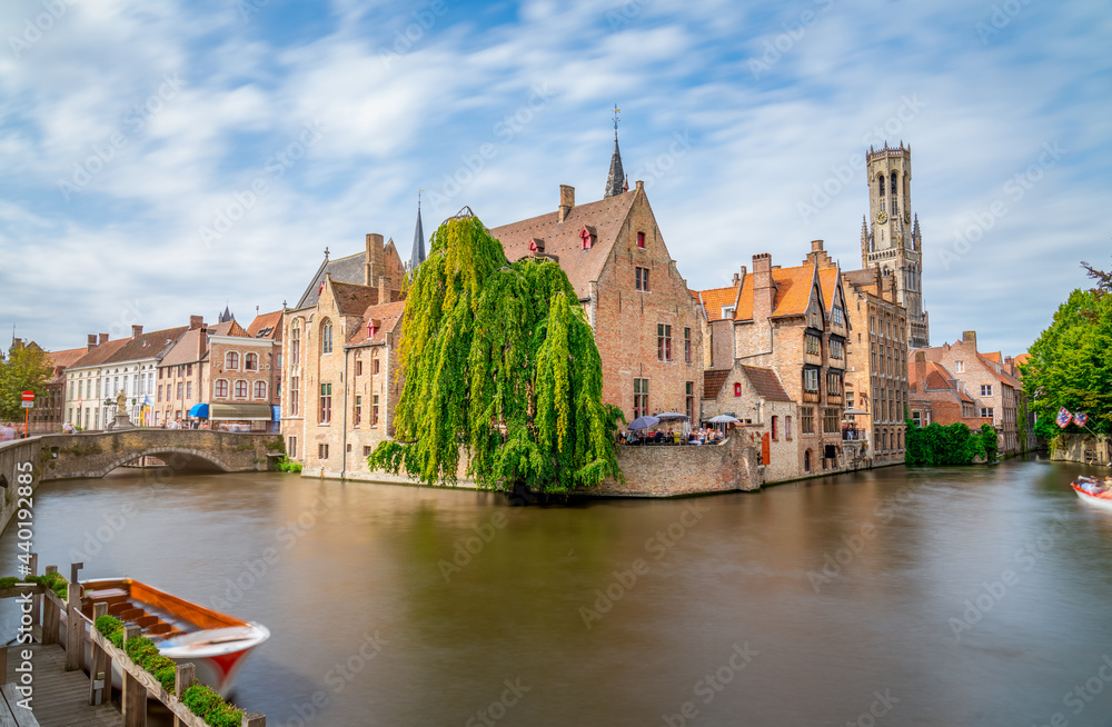 Bruges, Belgium. The Rozenhoedkaai canal in Bruges with the Belfry in the background
