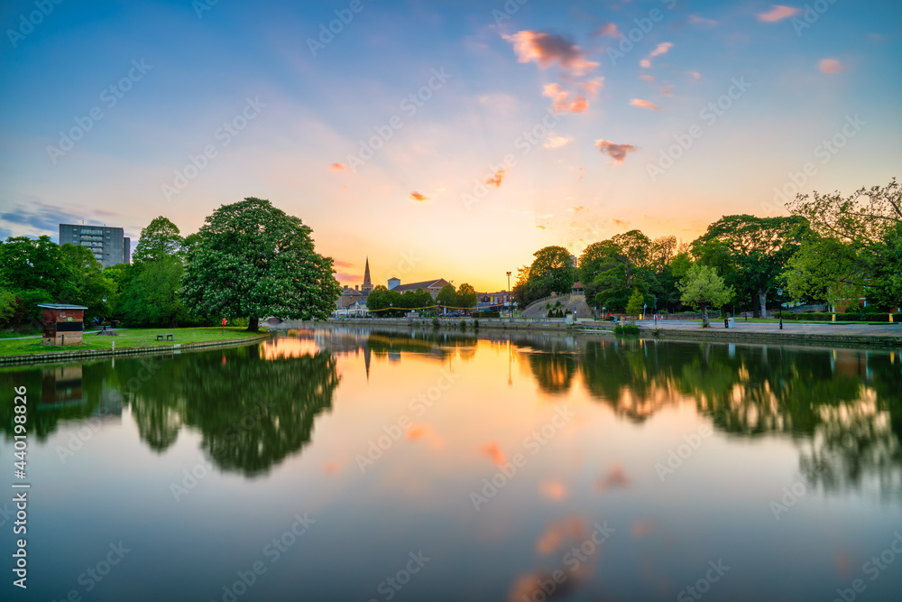 Great Ouse River overlooking tower of St Paul's church at sunset in Bedford. England Great Ouse River overlooking tower of St Paul's church at sunset in Bedford. England