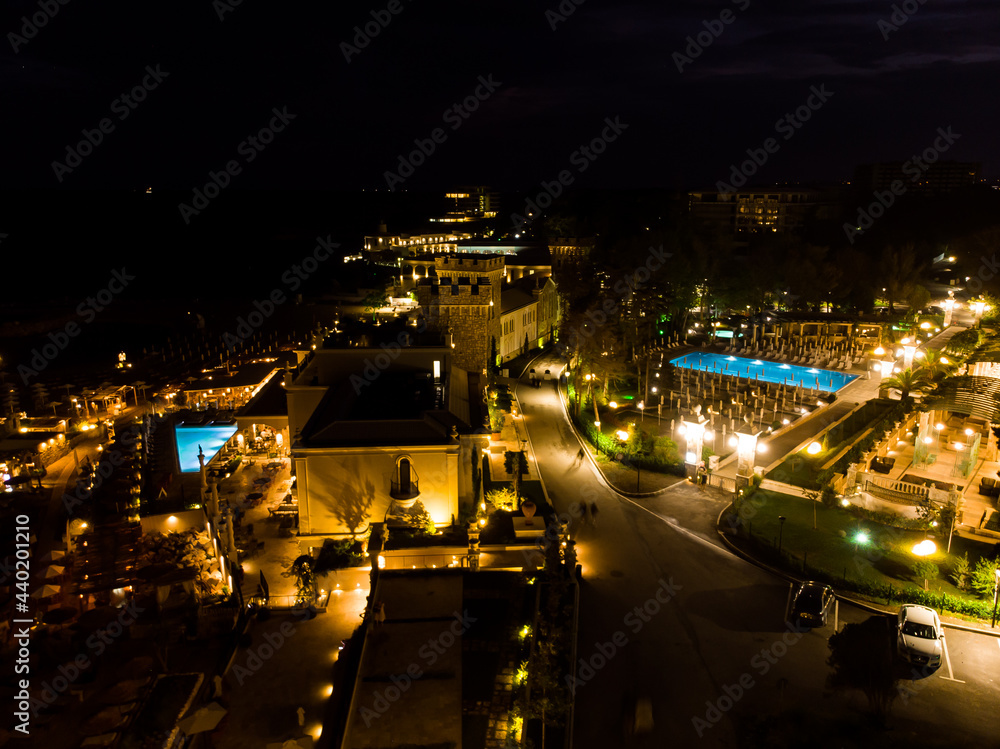 night evening drone view of five star hotel and pool in Bulgaria, summer luxurious resort, aerial view from above
