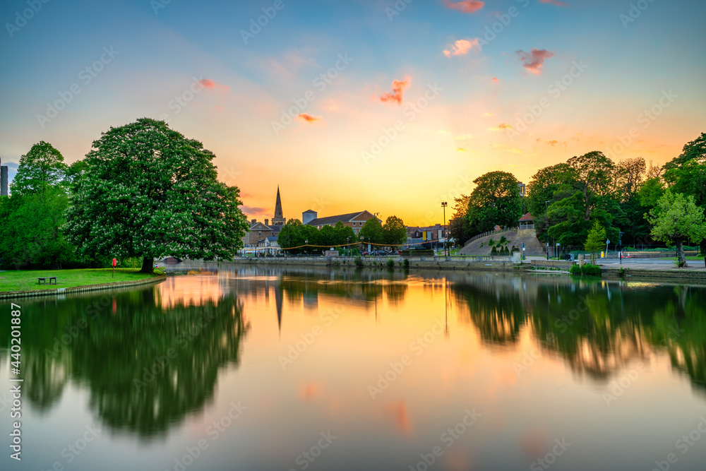 Great Ouse River overlooking tower of St Paul's church at sunset in Bedford. England 