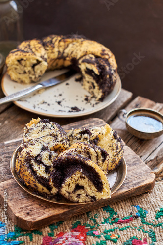 Poppy seed wreath bread. Wooden background, side view. Rustic.