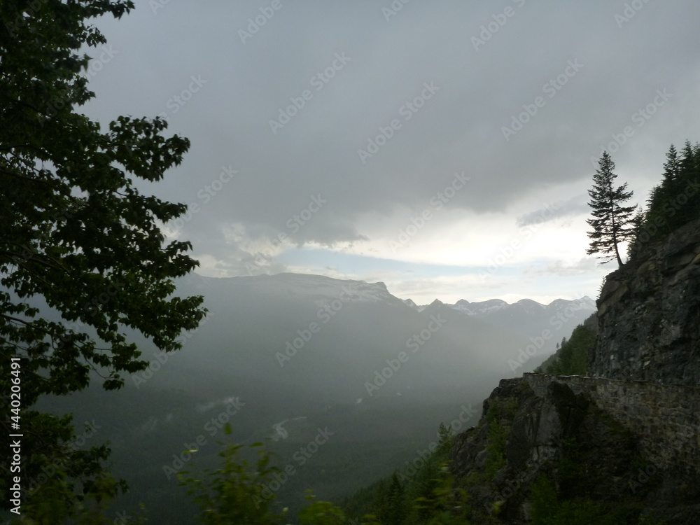 Moody mountain view at Glacier National Park on a cloudy and stormy day