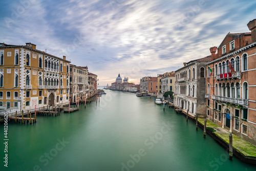 Long exposure view of Grand Canal and Basilica Santa Maria della Salute at sunset in Venice  Italy