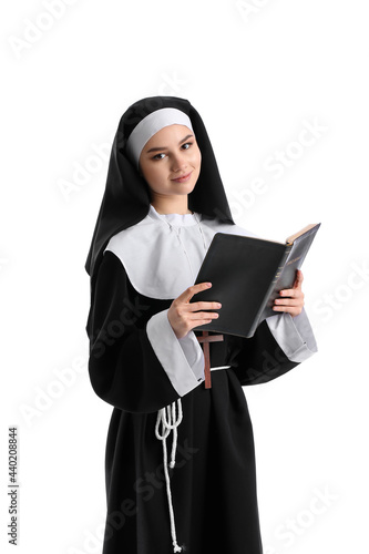 Young nun with Bible on whi...