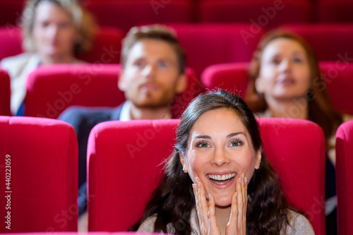 woman happy to watch the show bright positive emotions