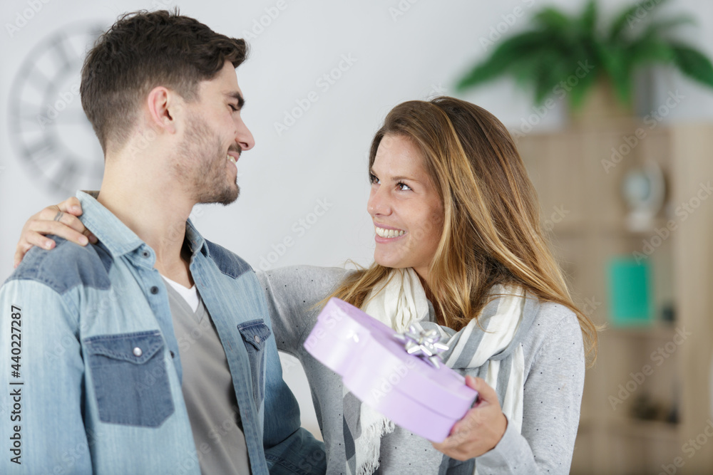 pretty woman surprising her boyfriend with gift pretty woman surprising her boyfriend with gift