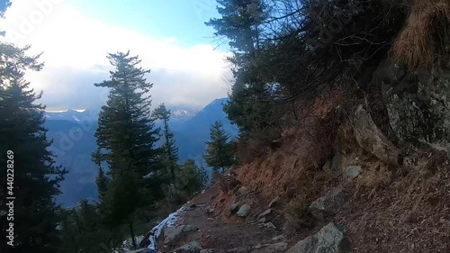 Point of View hyper lapse of Pine tree forest covered by snow on the way to Bijli Mahadev Temple during winter in Kullu at Himchal Pradesh, India	 photo