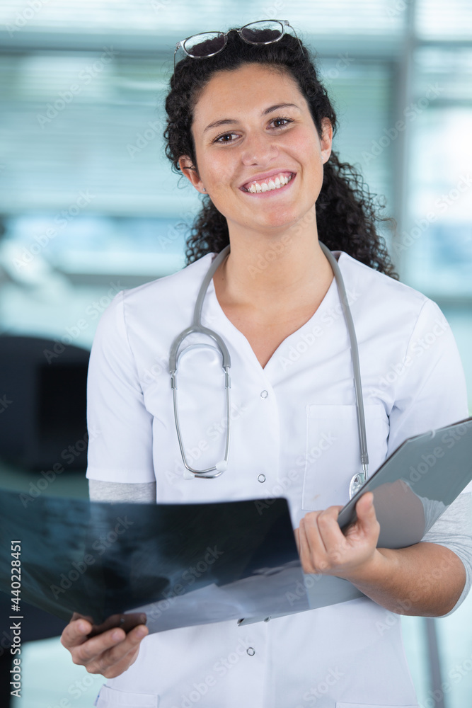 beautiful young doctor woman looking at a radiography beautiful young doctor woman looking at a radiography
