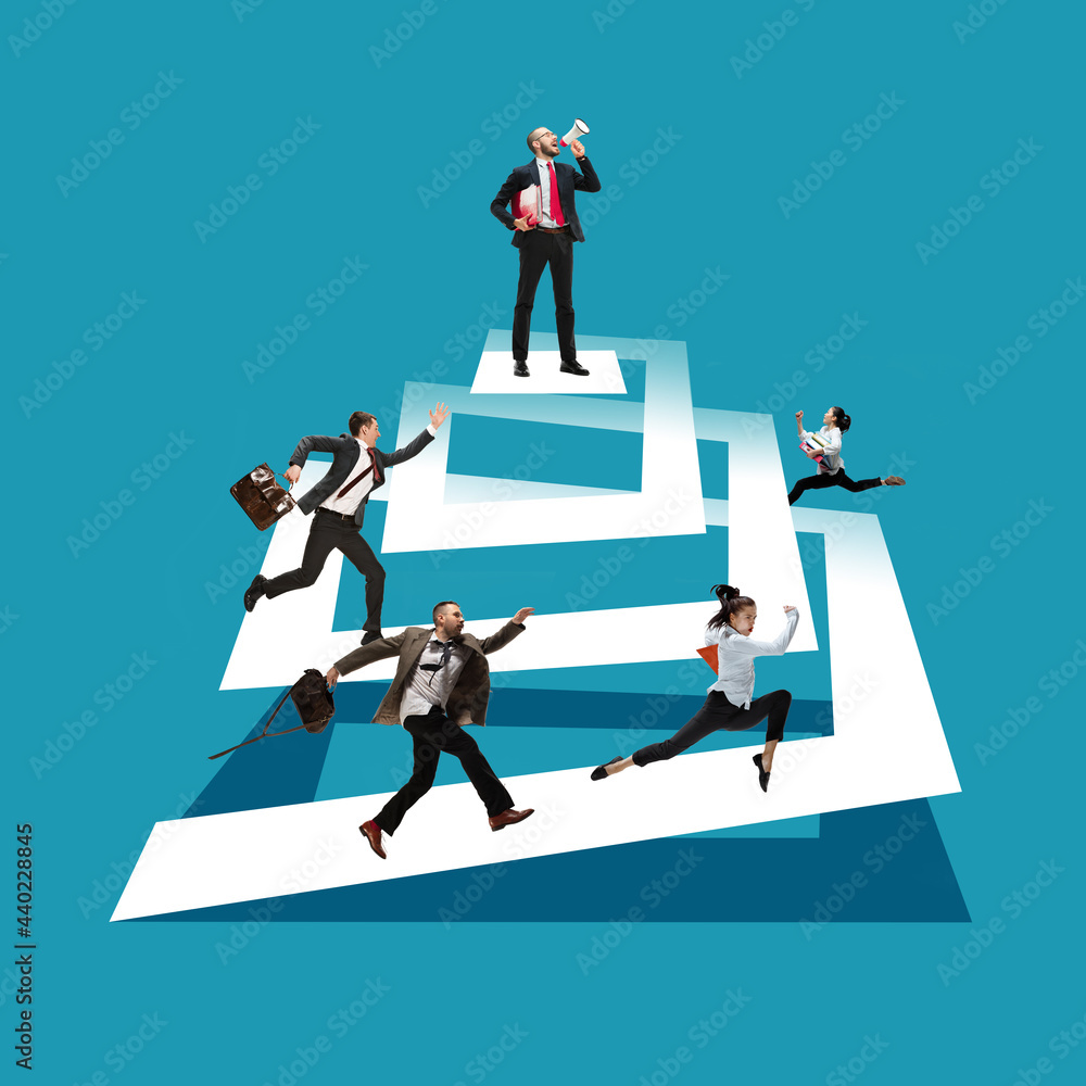 Fototapeta premium Boss with megaphone. Young men, clerks in business clothes standing isolated on blue background.