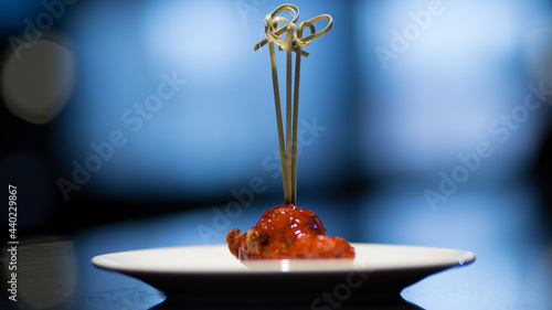 Fotografija Closeup shot of a deliciously cooked meat on a white plate