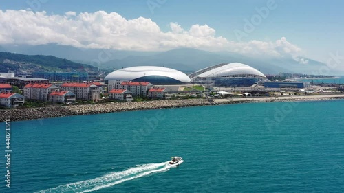 Aerial view Football stadium Fischt. Sochi, Adler, Russia. Cityscape modern olympic park new sports buildings epic dome. Futuristic architecture. Cinematic Russia landmark. Blue sea coastal area. 