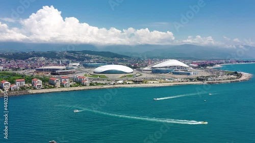 Aerial view Football stadium Fischt. Sochi, Adler, Russia. Cityscape modern olympic park new sports buildings epic dome. Futuristic architecture. Cinematic Russia landmark. Blue sea coastal area.  photo