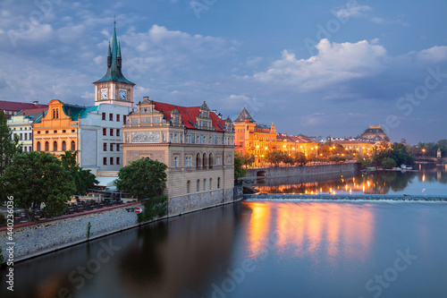Prague Riverside. Cityscape image of Prague riverside with Old Town Water Tower at twilight blue hour.