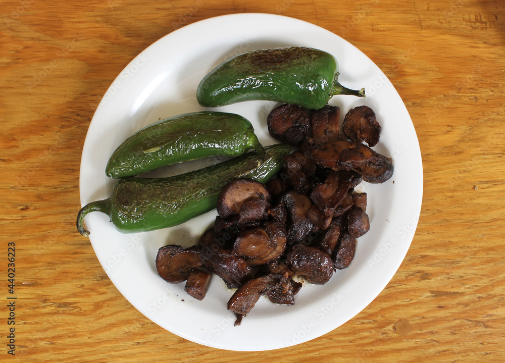 Roasted Green Jalapeno Peppers With Mushrooms in Rural Cafe Roasted Green Jalapeno Peppers With Mushrooms in Rural Cafe
