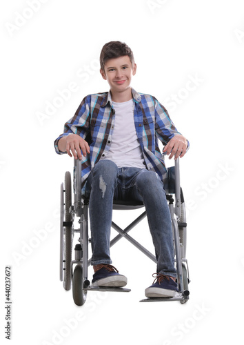 Teen boy in wheelchair on white background © New Africa