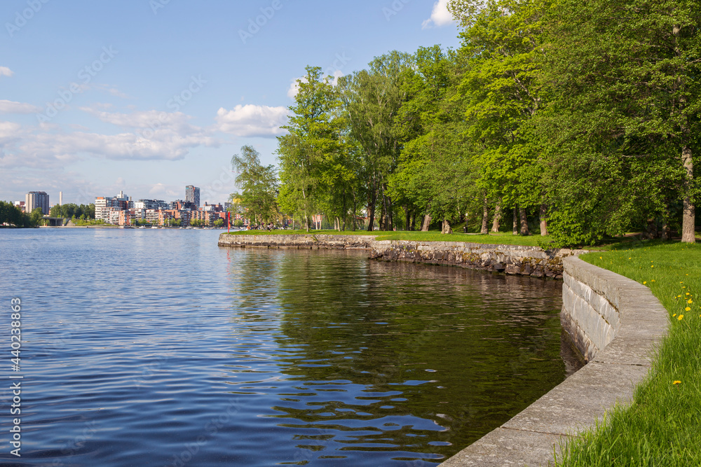 View of Tampere city over the lake Pyhäjärvi and Hatanpää arboretum in Finland in the summer.