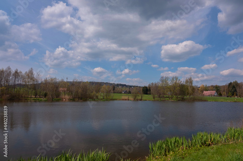 View of the pond in a small village, with a beautiful view of the clouds, a beautiful water level.