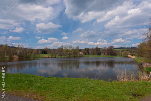 View of the pond in a small village, with a beautiful view of the clouds, a beautiful water level.