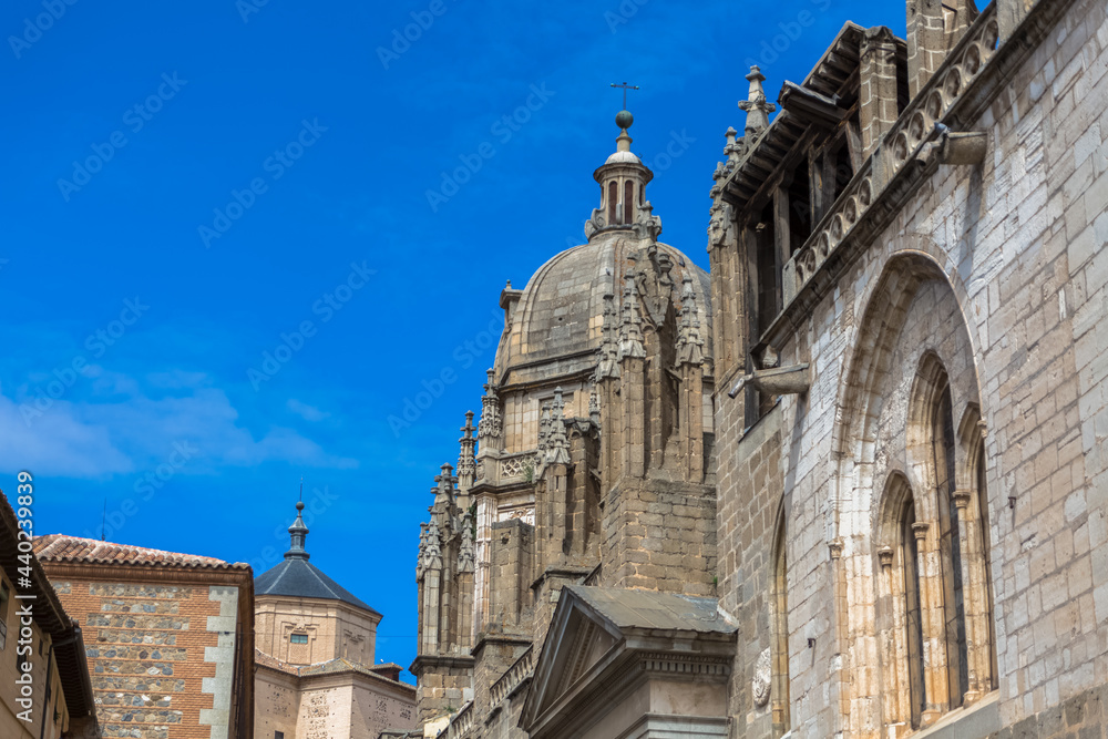 Detailed view at the lateral facade ornaments and tower dome, gothic monument building Primate Cathedral of Saint Mary of Toledo