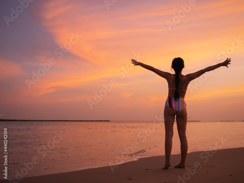 silhouette of a person on the beach at sunset 