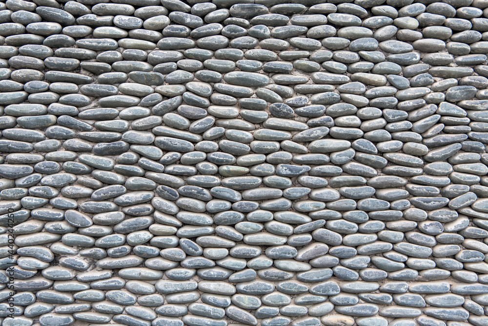 Stone wall with repetitive pattern ideal for background or textural use
