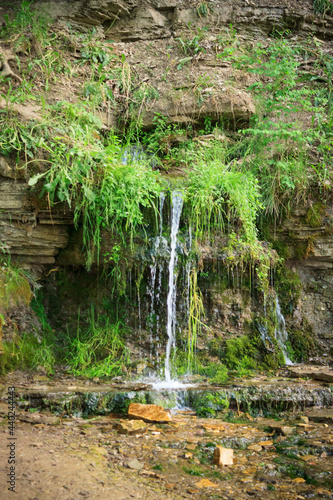 Slovenian Keys waterfall  illuminated source  living water out of the ground in the Izborsk  near Pskov. Travel of Russia.  