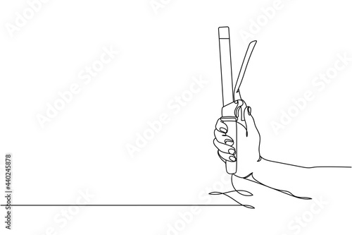 Continuous one line of curling hair iron in hand in silhouette on a white background. Linear stylized.Minimalist.