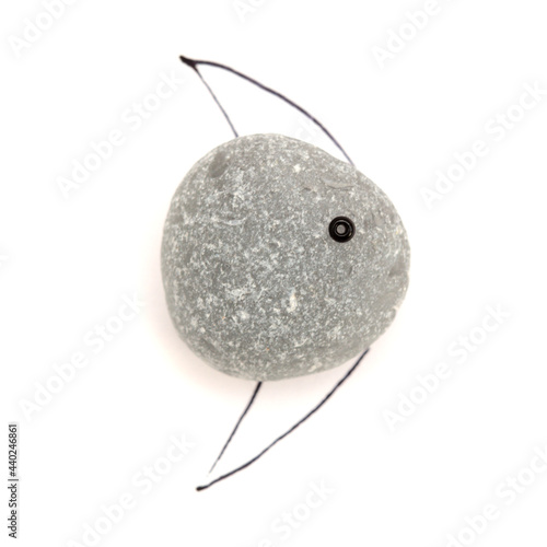 funny little fish made of a piece of seaglass, with sketchily drawn fins, isolated on white background
 photo