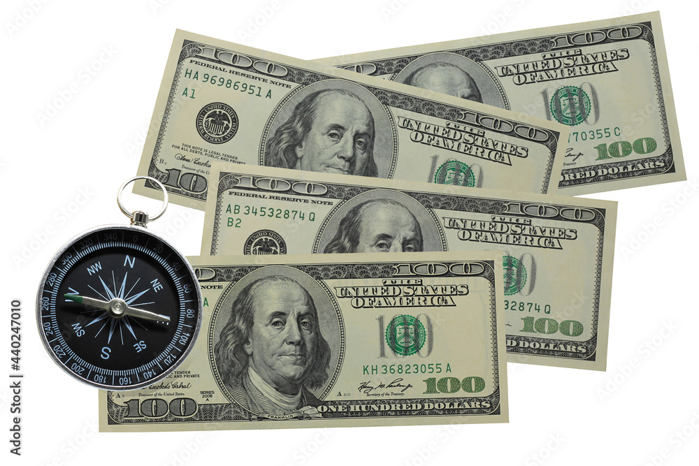 Round compass on paper dollar isolated on white background as symbol of tourism with compass, travel with compass and outdoor activities with compass Round compass on paper dollar isolated on white background as symbol of tourism with compass, travel with compass and outdoor activities with compass