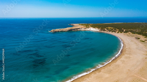 Fototapeta Naklejka Na Ścianę i Meble -  Aerial view of coastline of Cyprus beach.The steep stone cliffs and deep blue sea waves crushing in coves. beautiful turquoise waters of mediterranean
