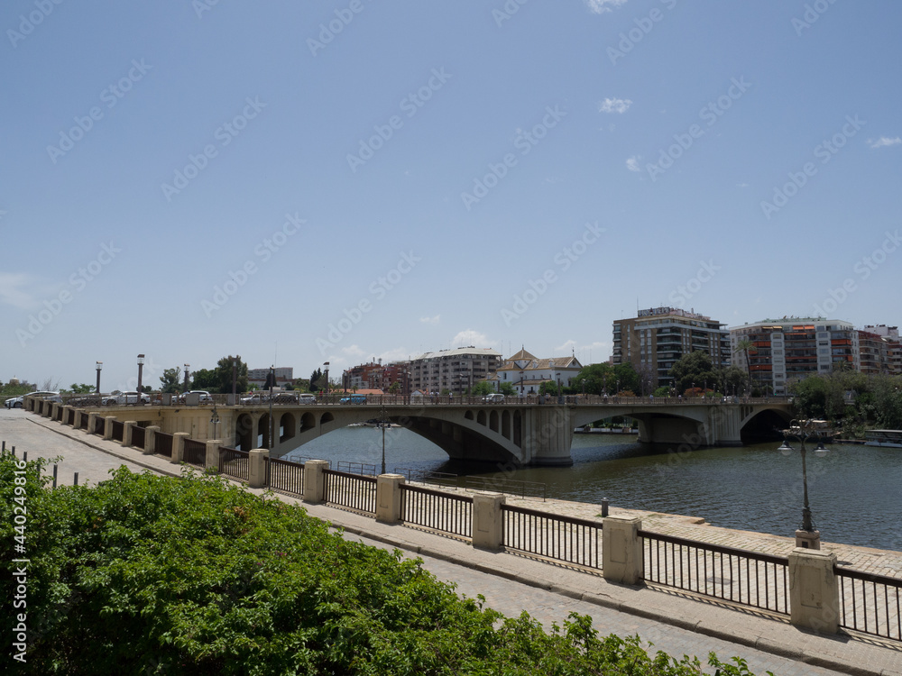 View of the San Telmo bridge in Seville, on the Guadalquivir river