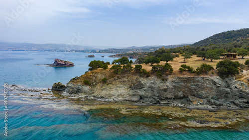 Aerial view of coastline of Cyprus beach.The steep stone cliffs and deep blue sea waves crushing in coves. beautiful turquoise waters of mediterranean