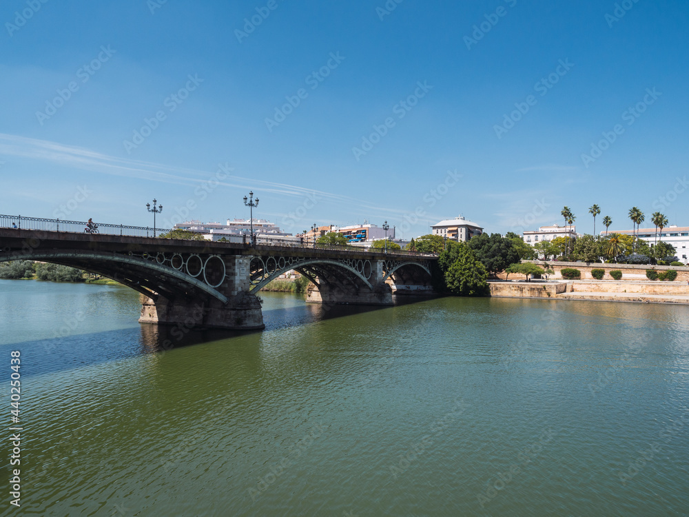 View of the Isabel II bridge ( Triana bridge) in Seville, on the Guadalquivir river