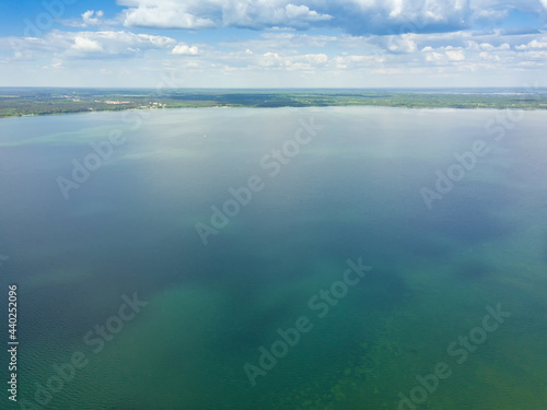 Drone view of Lake Naroch on a sunny summer day, Belarus. Beautiful landscape with a drone on the lake