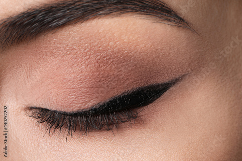 Beautiful woman with black eyeliner, closeup view