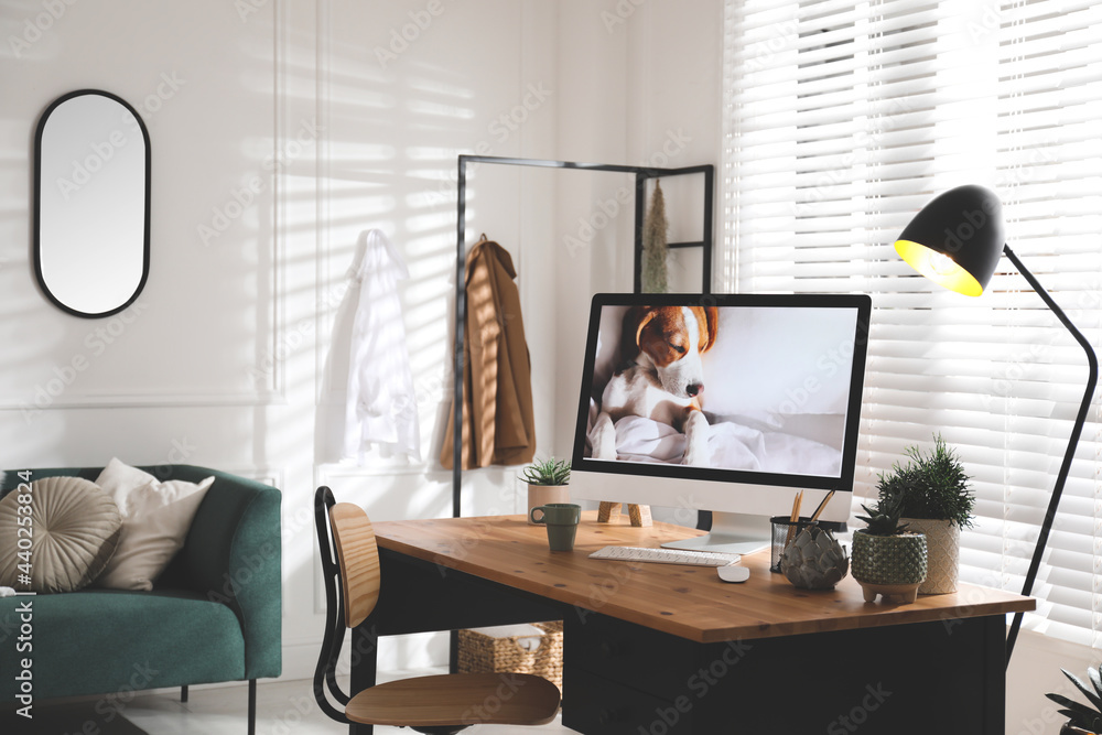 Stylish home office interior with sofa and comfortable workplace Stylish home office interior with sofa and comfortable workplace