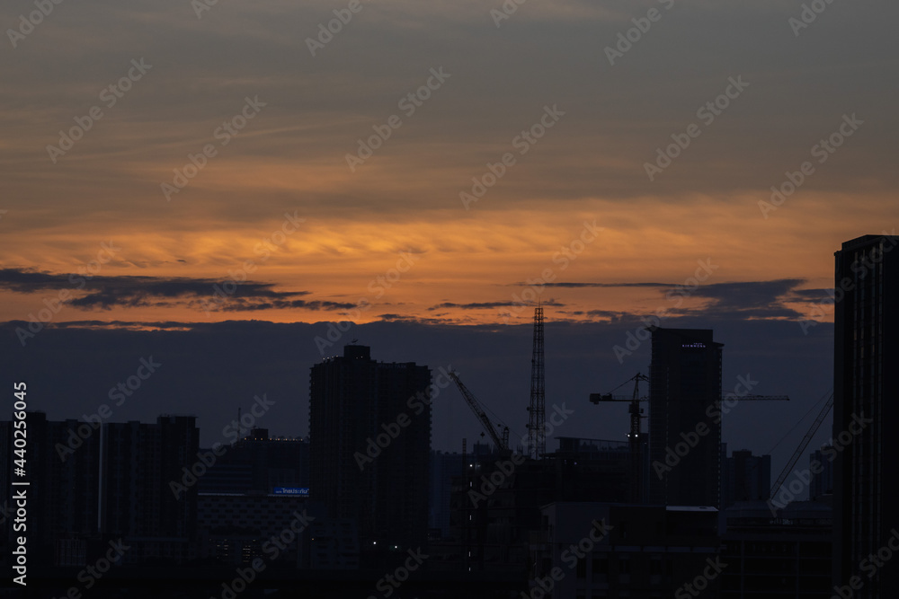 sunset over the city orange sky