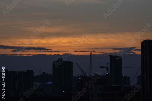 sunset over the city orange sky