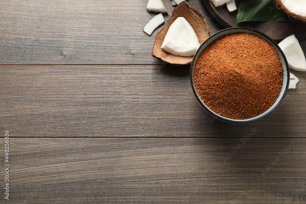 Flat lay composition with natural coconut sugar on wooden table, space for text Flat lay composition with natural coconut sugar on wooden table, space for text