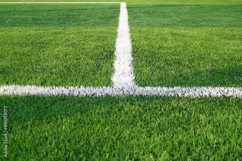 Vászonkép Artificial grass of football field with white stripe, Soccer corner line detail,