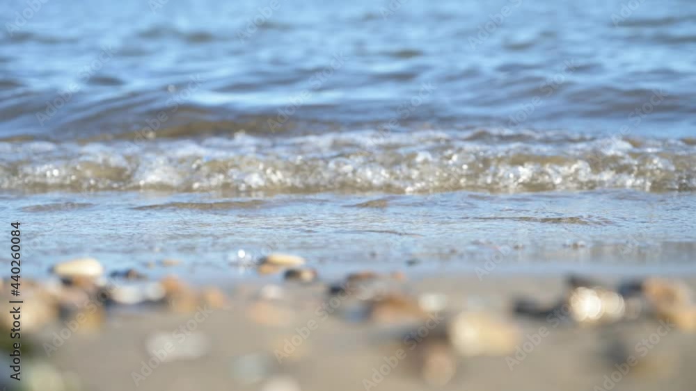 Waves at the seashore. Slow motion. Variable focus from foreground to background. Waves at the seashore. Slow motion. Variable focus from foreground to background.