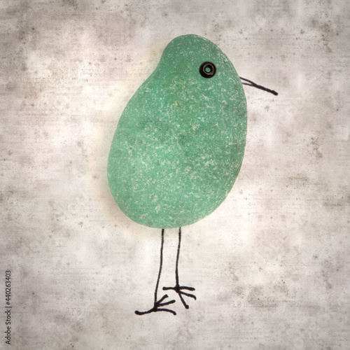 stylish textured old paper background with funny little birds made of sea glass pebble pieces 
 photo