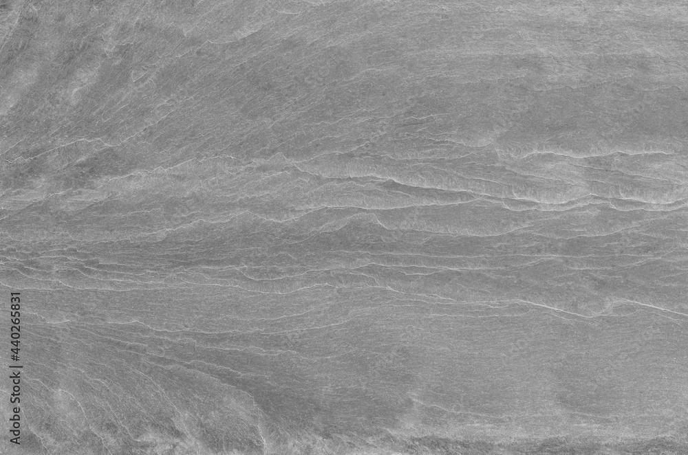 Black and white background. Gray rock texture. Grunge stone background. The texture of the mountains. Close-up. Grunge banner with volumetric rock texture Black and white background. Gray rock texture. Grunge stone background. The texture of the mountains. Close-up. Grunge banner with volumetric rock texture