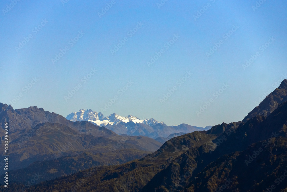 daytime landscape in the Caucasian mountains against the blue sky daytime landscape in the Caucasian mountains against the blue sky
